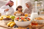 حبوب إفطار مع فواكه طازجة على مائدة إفطار عائلية في المنزل